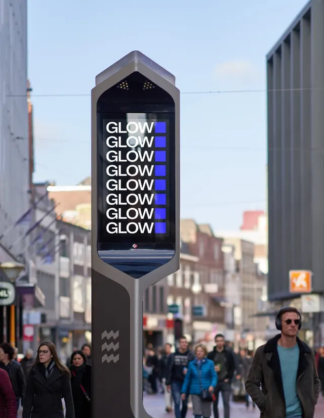 Glow repeated-wordmark street kiosk screen, photographic, typographic, dark