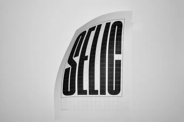 Vertical Wordmark on Curved Surface, minimal, swiss, monochrome