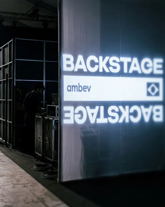 Ambev Backstage institutional branding campaign (slide 8), dark-mode, editorial, dark