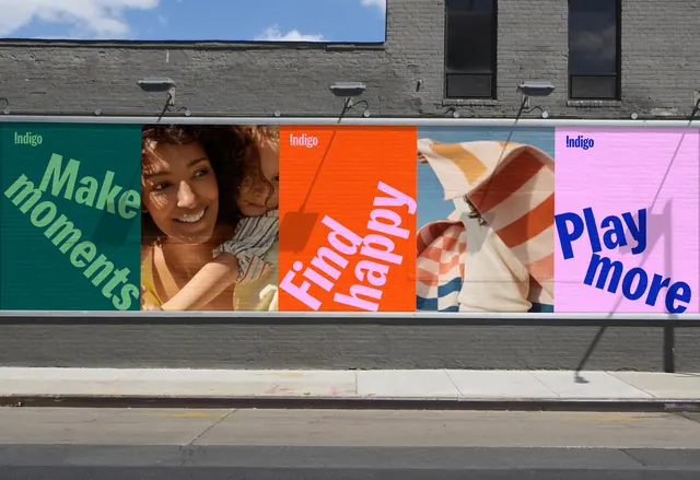 Indigo street hoarding alternating slogans and photography, photographic, typographic, vibrant