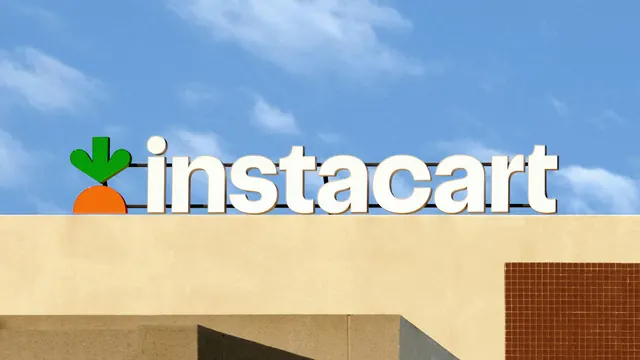 Instacart rooftop signage with carrot mark and rounded wordmark, photographic, minimal, light