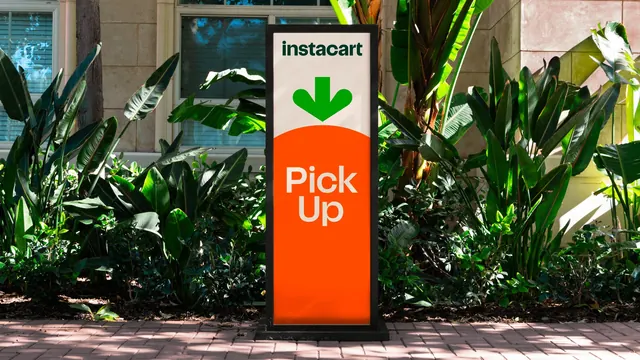 Instacart Pick Up monolith sign using the carrot as the panel, photographic, minimal, vibrant