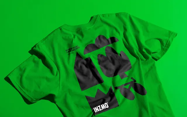 Inzmo green t-shirt with oversized black plant and bicycle print, minimal, geometric, vibrant