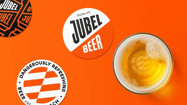 Jubel beer mats and branded pint, photographic, typographic, vibrant