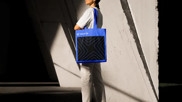 Mark OS blue tote in hard sunlight, photographic, minimal, cool