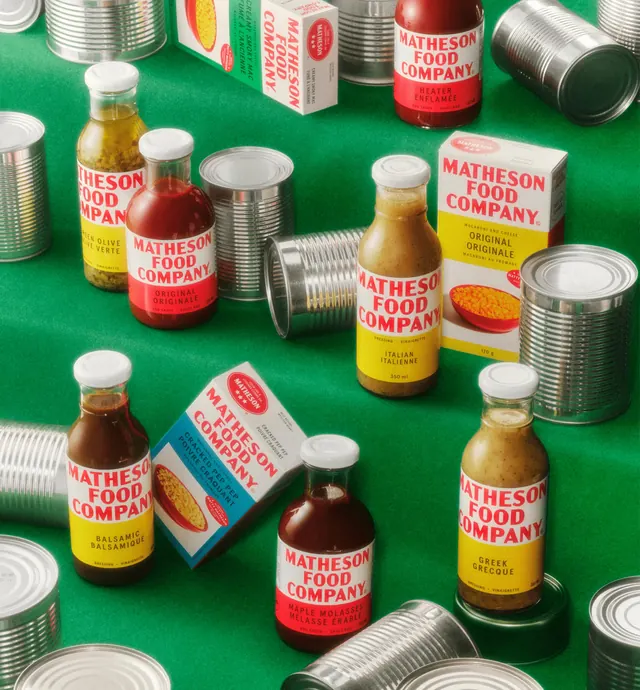 Matheson range scattered among unlabelled tin cans on green, photographic, retro, vibrant