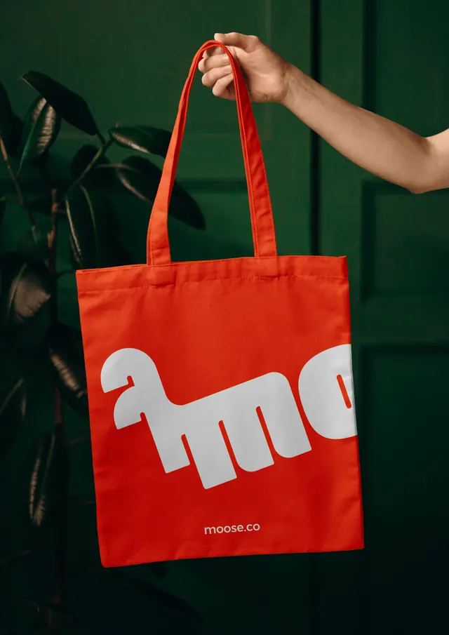 Moose tote bag with cropped oversized logotype, photographic, playful, vibrant