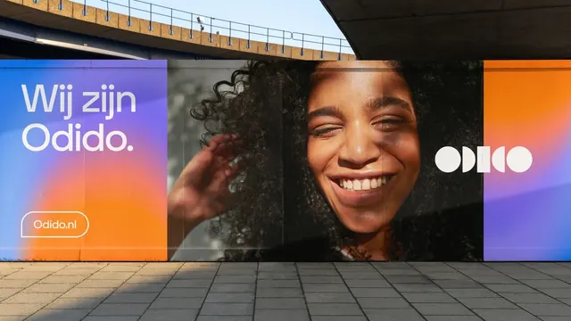 Odido hoarding wall with portrait panel, gradient-heavy, photographic, vibrant