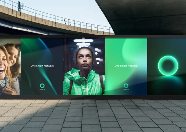 one.nz digital screen wall in a concrete underpass, minimal, dark-mode, dark