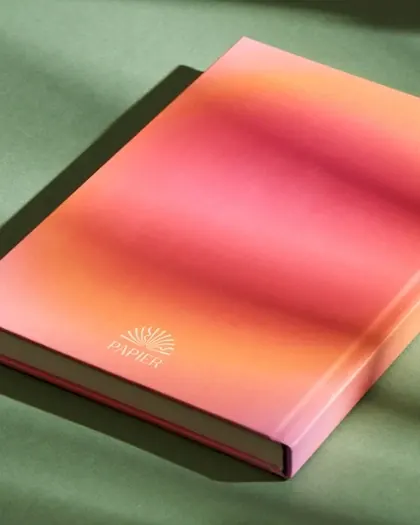 Papier notebook with pink and orange aura cover, minimal, gradient-heavy, gradient