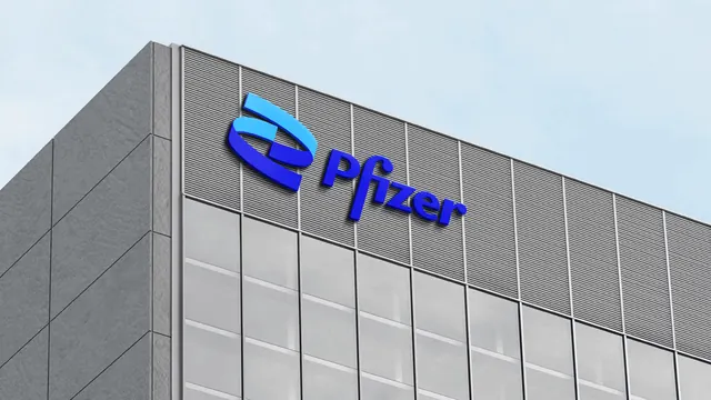 Pfizer dimensional logo signage on a building facade, photographic, architectural, cool