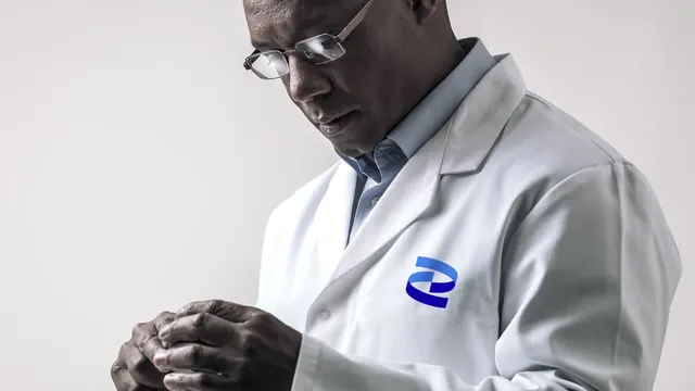Pfizer lab coat portrait with chest mark, photographic, minimal, light