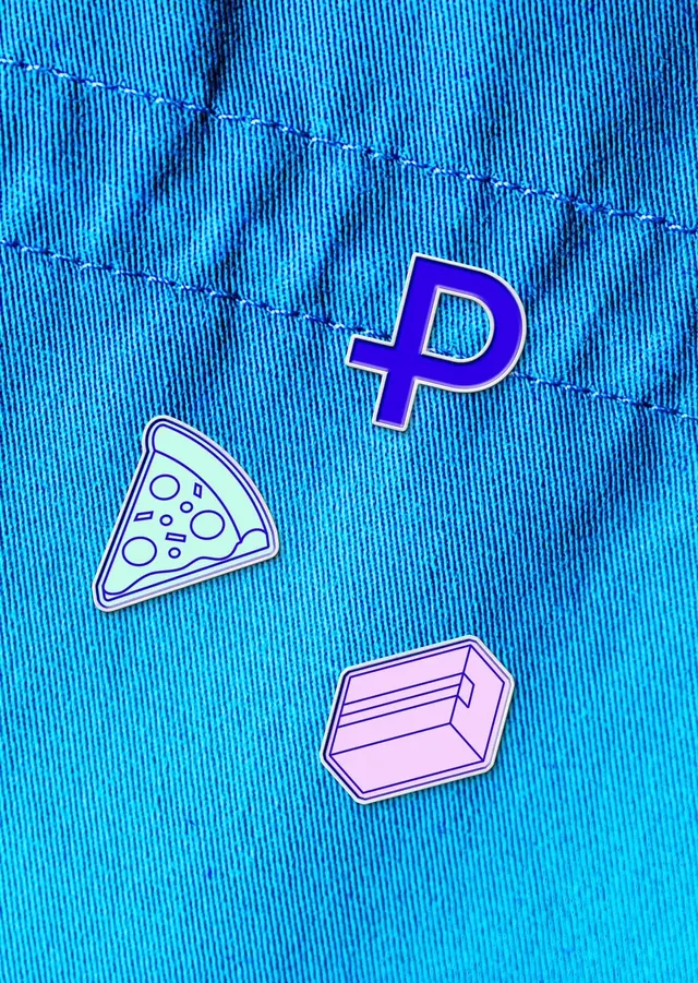 Plutus enamel pins on blue denim, photographic, playful, vibrant