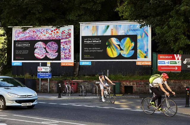 Project What If billboards on a city street with cyclists, typographic, photographic, vibrant