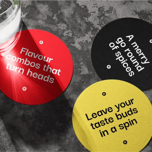 Rotorious slogan beer mats in red, black and yellow, playful, photographic, vibrant