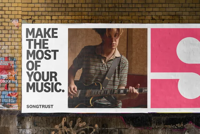 Songtrust wheatpaste billboard on brick, swiss, photographic, light