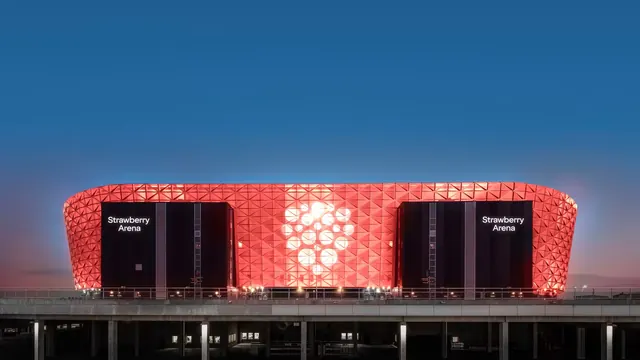 Strawberry Arena facade at dusk, architectural, cinematic, vibrant