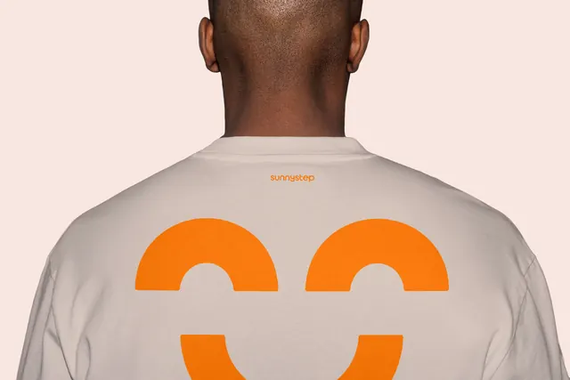 SunnySTEP smile mark on t-shirt back, minimal, photographic, warm