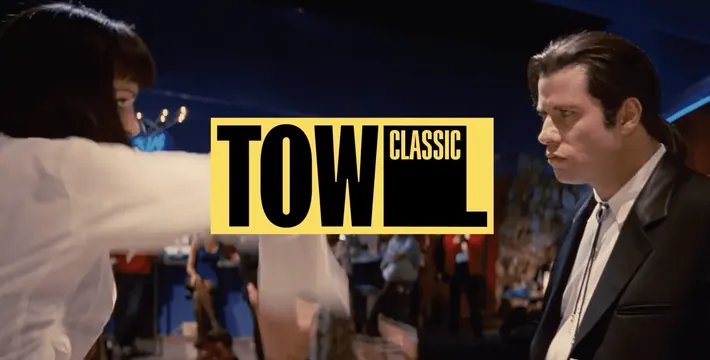 TOW Classic sub-brand lockup over a film still, cinematic, brutalist, dark