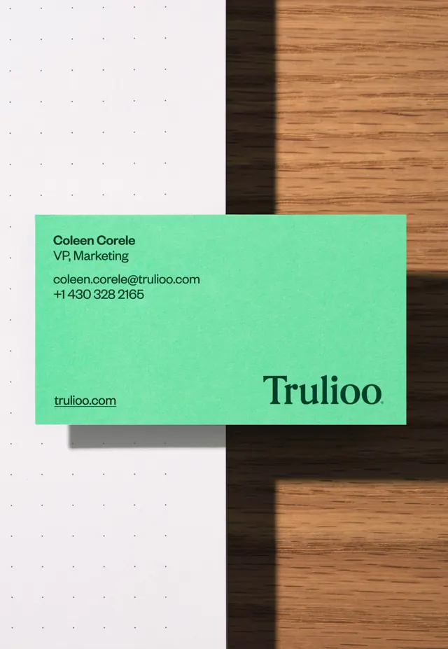 Trulioo mint business card on wood and dotted paper, minimal, photographic, vibrant