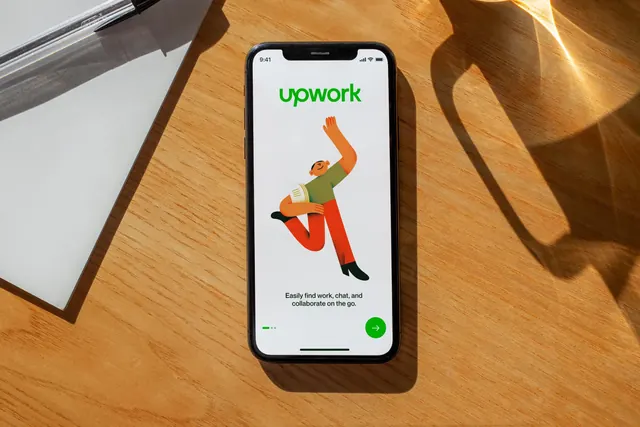 Upwork app onboarding screen on a sunlit desk, photographic, illustrated, warm