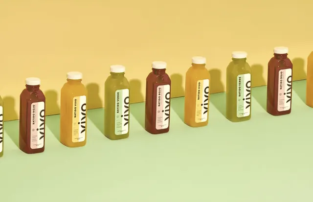 Vivo juice range lined up on yellow and green, photographic, minimal, warm