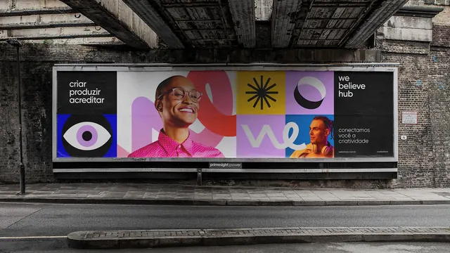 We Believe Hub modular billboard under a rail bridge, geometric, flat, vibrant