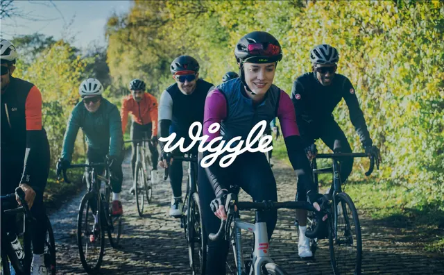Cycling group photograph with centred white script logo, photographic, cinematic, warm
