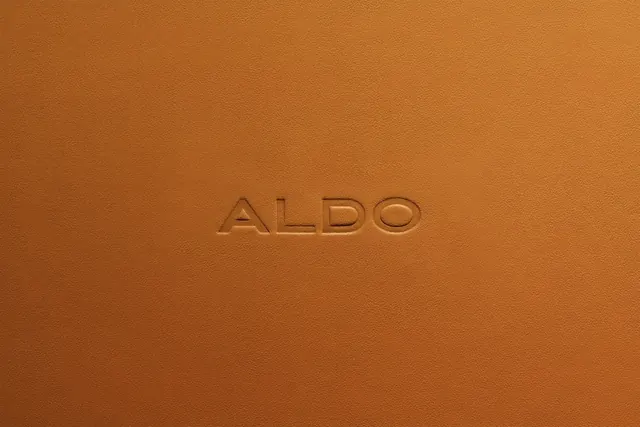 ALDO leather branding minimalist presentation, minimal, luxury, warm