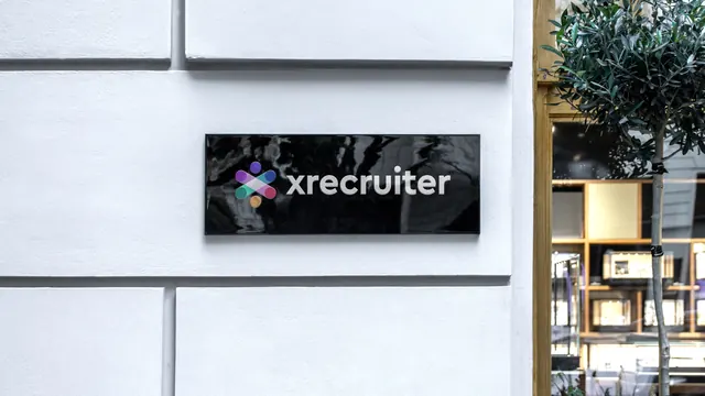 Gloss black wall plaque with gradient dot-cluster mark, photographic, minimal, dark