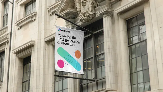 Facade banner with cross motif on a heritage stone building, photographic, geometric, light