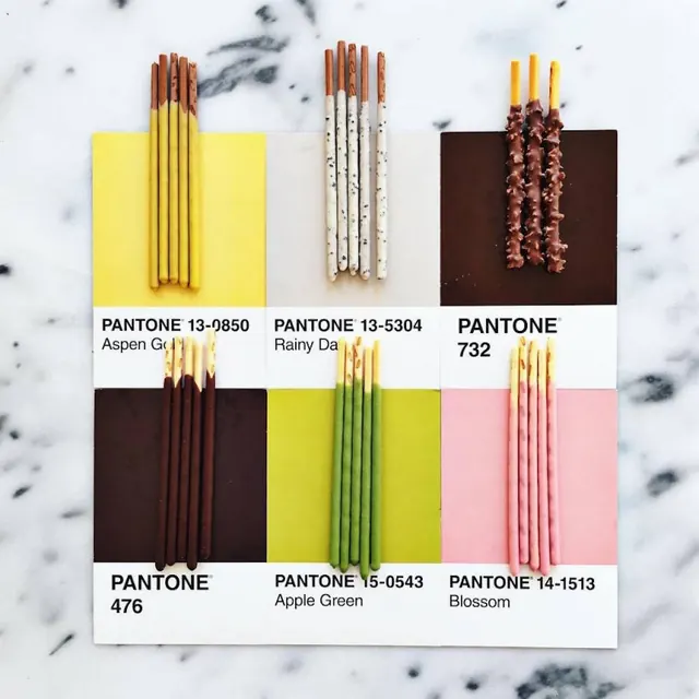 Pantone color palette with pencils and chips, infographic, minimal, vibrant