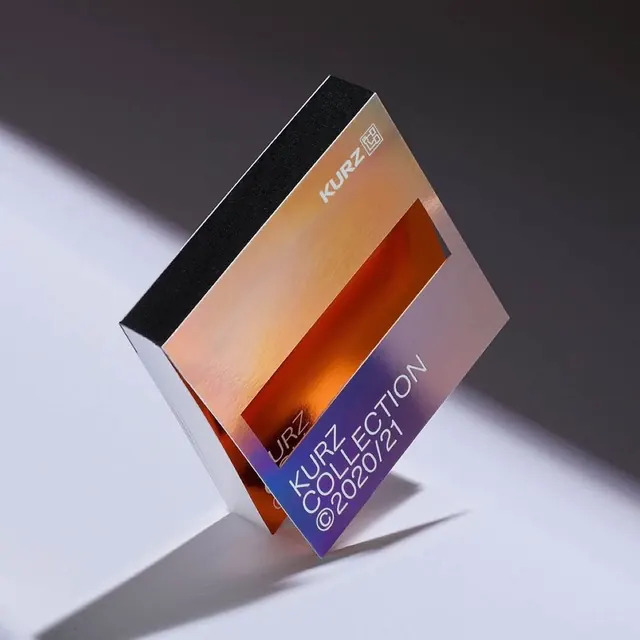 KURZ iridescent packaging on gray, minimal, luxury, vibrant