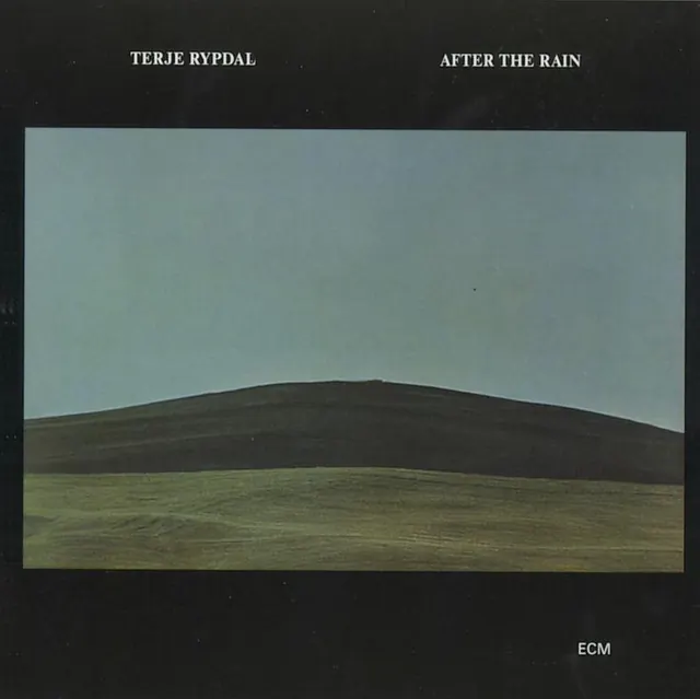 Album cover with minimalist landscape and serif typography, minimal, editorial, dark