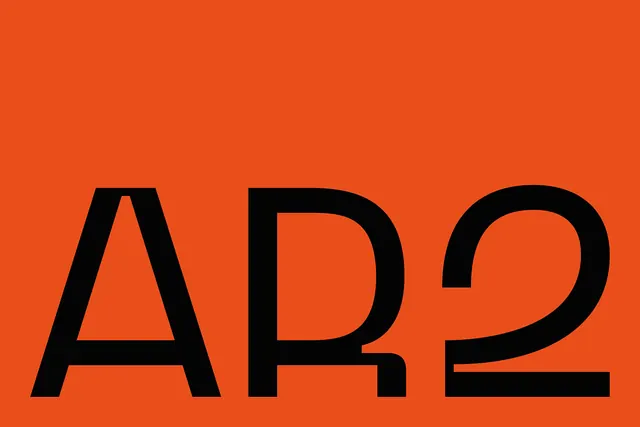 AR2 bold black typography on bright orange background, bold, minimal, vibrant