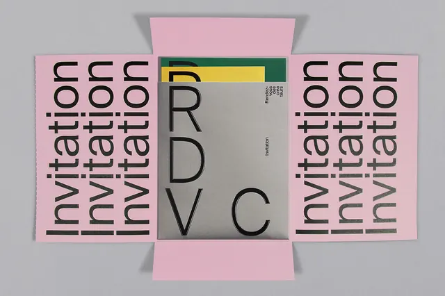 Pink typographic invitation folder with cutout lettering, minimal, editorial, muted