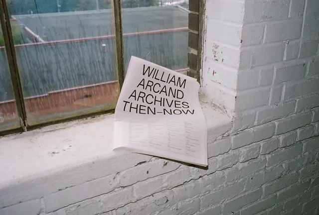 William Arcand Archives broadsheet on windowsill, editorial, minimal, light