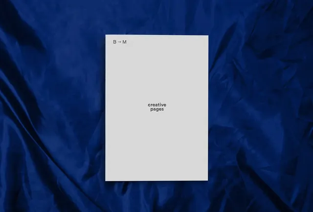 B to M creative pages card on blue fabric, minimal, dark