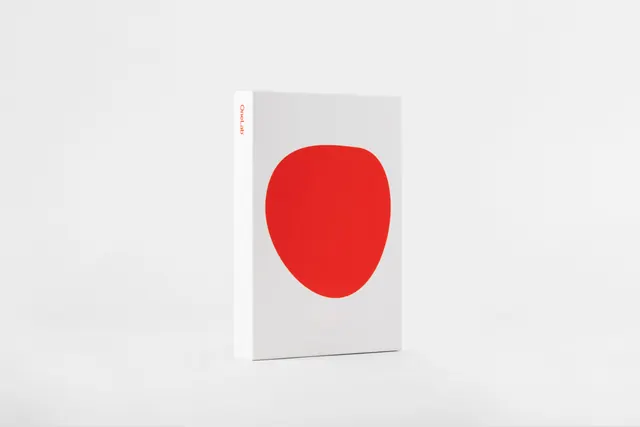 Red Circle Graphic on White Book, minimal, geometric, high-contrast