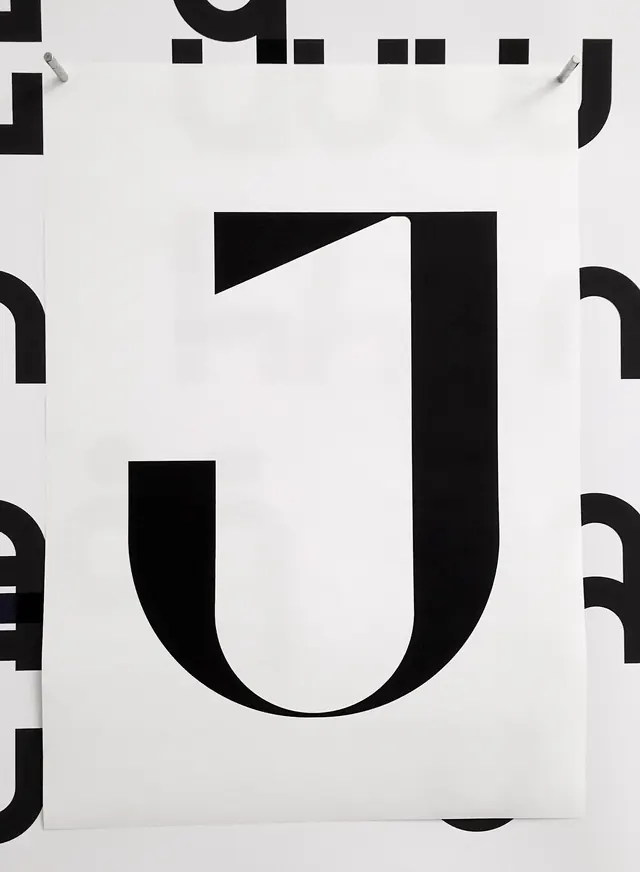 Typographic cutout letter J, minimal, monochrome, monochrome
