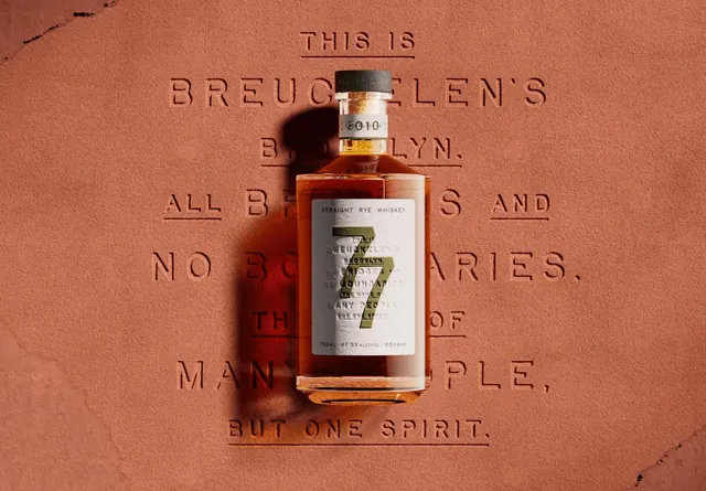 Breuckelen Distillery rye whiskey bottle, editorial, minimal, warm