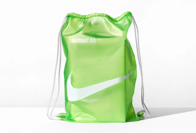 Nike Instant Go green cinch bag, minimal, technical, vibrant