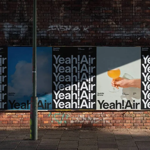 Yeah!Air Girona poster series on brick wall, bold, graphic, vibrant