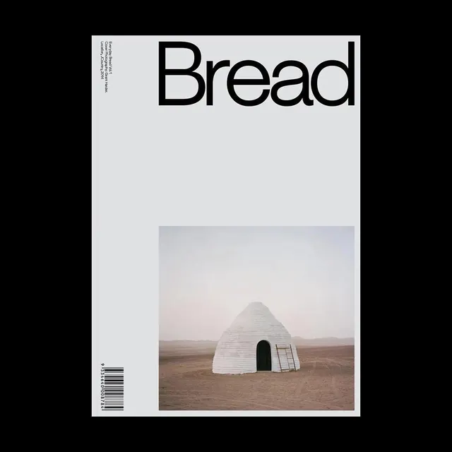 Bread magazine cover with minimal desert structure, editorial, minimal, light