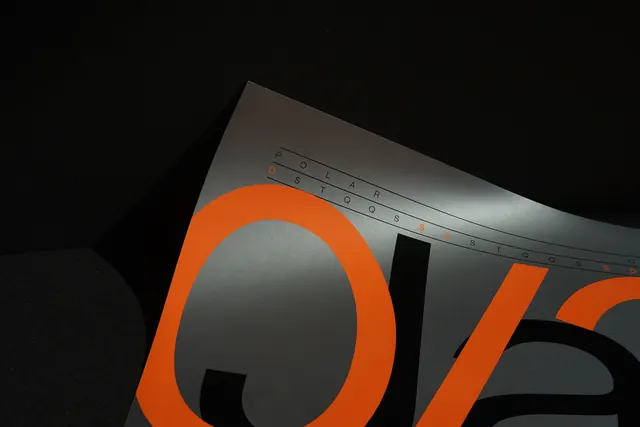 Polar Star orange and metallic typography poster detail, minimal, editorial, dark