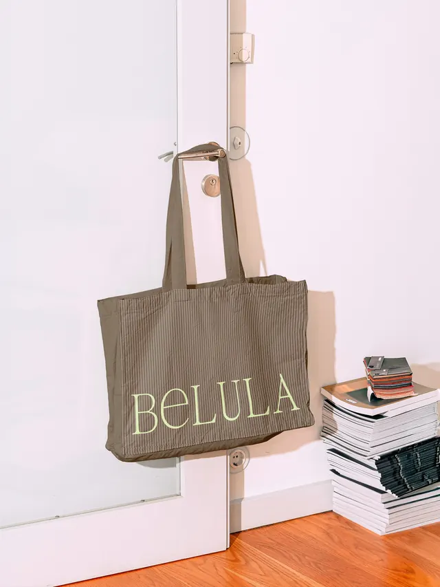 BeLULA product styling carousel with utensils and natural elements (slide 4)