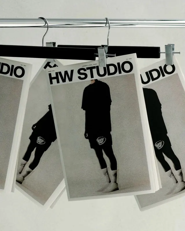 HW STUDIO lookbooks on rack, minimal, editorial, monochrome