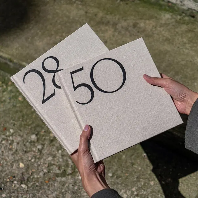 Linen books numbered 50 and 28, minimal, editorial, muted