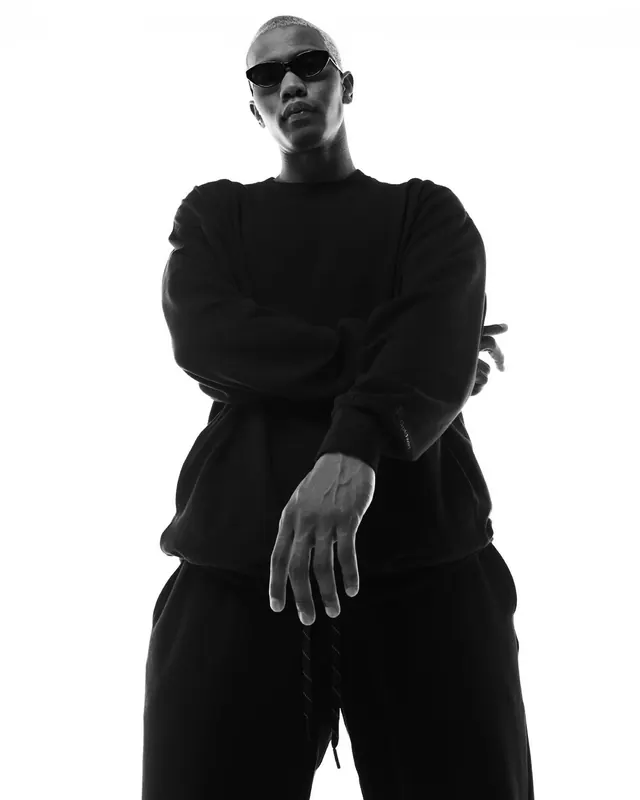 Goldwin apparel brand lookbook, minimal, corporate-clean, monochrome