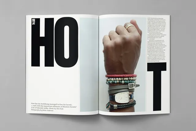 Editorial Spread with Large Typography and Hand Illustration